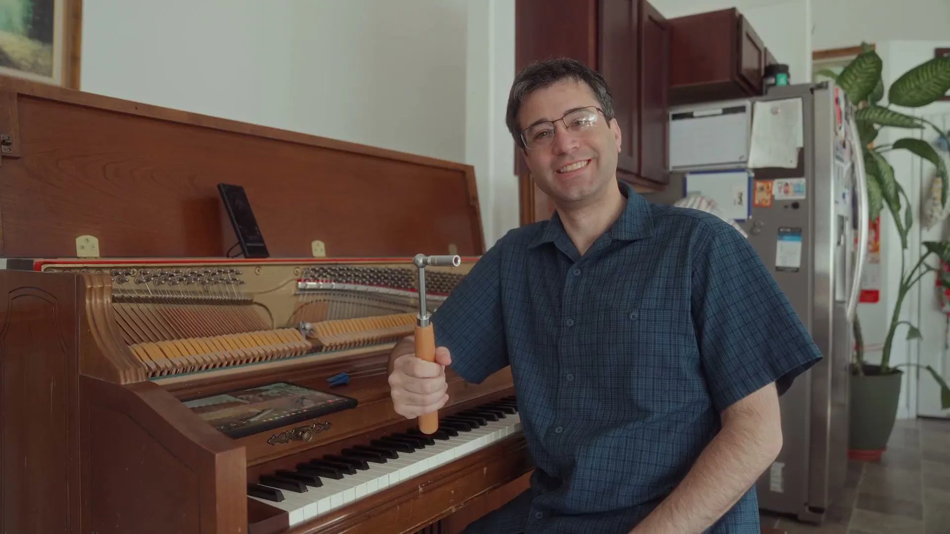 Your TrueKeys technician at an upright piano in a client's home